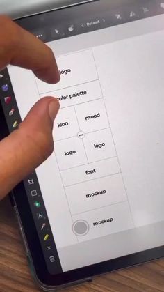 a person is typing on an ipad with their fingers and touching the screen that has icons