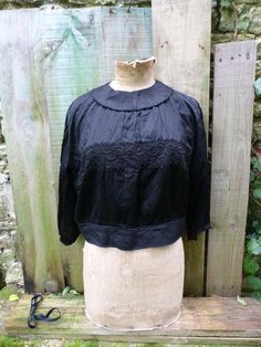 Black Lace Top Blouse For Daywear, Vintage Black Long Sleeve Blouse, Black Lace Trim Blouse For Daywear, Black Lace Top For Daywear, Black Silk Tops For Daywear, Black Silk Tops With Lace Trim, Black Spring Wedding Tops, Formal Black Tops With Lace Collar, Formal Black Top With Lace Collar