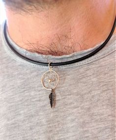 Men's necklace in black rubber with Silver clasp, decorated with Silver Dreamcatcher charm. The necklace is 40 cm long and 1.5 cm in diameter. Necklace that combines perfectly with matching silver earrings. It is an amulet necklace, the tribes of North America used and use this image to protect themselves from nightmares and evil thoughts. The silver Dreamcatcher pendant measures 1.5 cm in diameter and 3.5 cm in total length. Silver is an amazing material not only in the field of jewelry, but al Evil Thoughts, Dreamcatcher Necklace, Dreamcatcher Pendant, Cotton Bracelet, Dream Catcher Necklace, Mens Earrings Hoop, Hammered Earrings, Amulet Necklace, Mens Silver Necklace