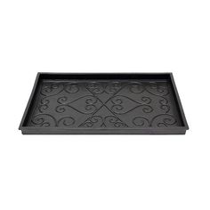 a black tray with an ornate design on it