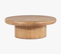 a round wooden table on a white background