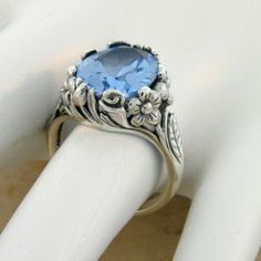 Vintage Estate 7.00 Carat Simulated Sky Blue Topaz Solitaire Filigree Ring. Floral Designs. 925 Solid Sterling Silver. Stamped 925. Excellent Condition/Like New. Topaz Ring Stamped 925, Sapphire Topaz Ring In Sterling Silver, Stamped 925 Topaz Ring, Classic Blue Topaz Ring Stamped 925, Vintage Sapphire Topaz Promise Ring, Vintage Sterling Silver Topaz Ring With Accent Stones, Vintage Sterling Silver Topaz Ring For Gift, Vintage Blue Topaz Birthstone Jewelry, Vintage Sterling Silver Topaz Solitaire Ring