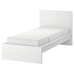 a white bed frame with no mattress on it