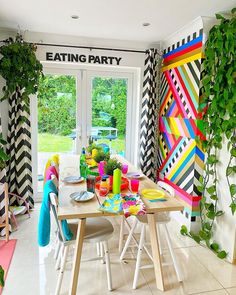 a dining room filled with lots of colorful furniture and decor on top of white tile flooring