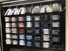 a display case filled with lots of different types of shirts