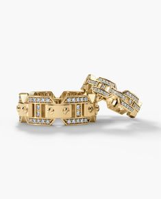 two yellow gold rings with diamonds on them