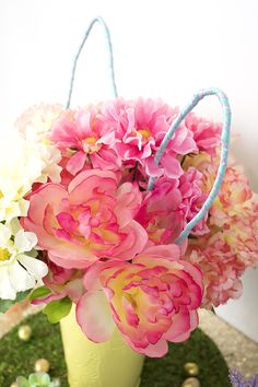 pink and white flowers in a green vase