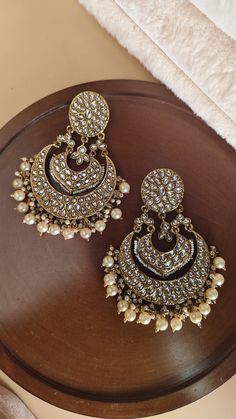 Mirror chandbali earrings/ Kundan earrings /Statement earrings / Bridal earrings/Pearl drop earrings/CZ Jhumka /Bridesmaid Earrings Making Time 10-15 Days Style: Victorian In Personal trust me this is so much beautiful and in great quality, video call also available too see our products. Stunning Sonam Kapoor inspired Jadau Kundan Jhumka statement earrings with green onyx Pearls chains and drops. Perfect to make a statement at weddings. Earrings come with attached sahare (kaanchain) for support High quality and craftsmanship. Closure: Pushback Highest quality and craftsmanship   Women love jewellery; specially artificial jewellery adore a women, They wear it on different occasion, They have special importance on ring ceremony, wedding and festive time, They can also wear it on regular basi Luxury Traditional Bridal Earrings With Latkans, Chandbali Earrings Kundan, Capsule Wardrobe Jewelry, Pearls Chains, Kundan Jhumka, Pearl Drop Earrings Bridal, Earrings Kundan, Earrings Pearl Drop, Jewellery Photography Inspiration