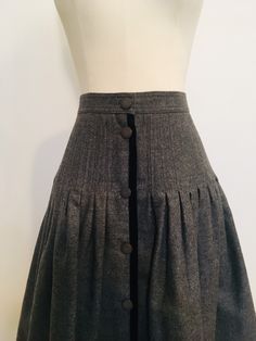 "True gem! This 80s Miss V Valentino wool buttoned down skirt with black velvet trim. Pleated fit and flare. Made in Italy. Excellent vintage condition. Labeled 42/8. Laid flat: 13.5\" waist, 19.5\" hips, 22\" top to bottom. Please note that vintage sizing can be tricky due to mass production today, size labels vary. Please see measurements to help. Thank you and enjoy" Fitted Wool Pleated Skirt, Fall Fitted Skirt With Button Cuffs, Vintage Winter Skirt With Buttons, Fitted A-line Skirt With Buttons, Full Skirt With Button Closure And Fitted Waist, A-line Fitted Skirt With Buttons, Miss V, Leather Cowgirl Boots, Knee Skirt