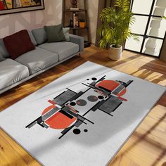 a living room with a couch and rug on the floor