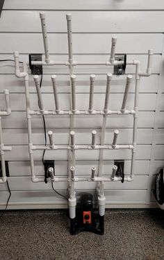 several pipes are connected to the side of a building