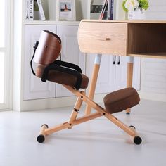 a chair with a cup on it sits in front of a desk that has drawers