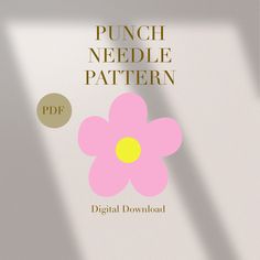 a pink flower sitting on top of a white table next to a window with the words punch needle pattern