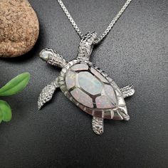 Visit our online shop at: Etsy.com/shop/925ForHer *sterling silver necklace pendant / sea turtle *small pendant with the option to buy a silver box chain necklace 16, 18, or 20 inches *southwestern jewelry *white opal / lab created / inlaid opal *calibrated pre-cut stones: inlaid  opal *back of jewelry items are all covered / do not show the back of stones *all jewelry items are made to ship, slight variations in stones will occur compared to pictures. *size of a penny is 19mm or a dime is 18mm in diameter for comparing the size with jewelry items. *free small convenient gift box *free shipping in the US, shipping from the US without insurance. *most orders will be shipped same day or within 24 hours from the time of placing orders during USPS working hours. *seller provides one-time FREE Silver Sterling Silver Turtle Jewelry, Silver Turtle Jewelry Gift, Silver Turtle Jewelry For Gifts, Sterling Silver Turtle Necklace For Gifts, Sterling Silver Turtle Necklace For Gift, Silver Turtle Necklace For Gift, Elegant Sterling Silver Turtle Jewelry, Elegant Silver Turtle Jewelry, Sterling Silver Turtle Jewelry Gift