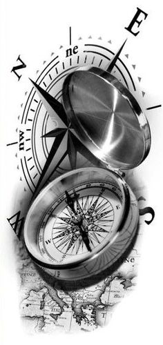 a black and white photo of a compass