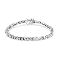 Elegante y clásico, este brazalete de tenis tiene un impresionante peso total en quilates de 3 quilates. Elaborado en brillante oro blanco de 14k, este brazalete está bellamente engastado con diamantes cultivados en laboratorio de talla redonda. Los diamantes están adornados en un engaste milagroso, dando a las piedras una ilusión de mayor tamaño. Esta pulsera se cierra con un cierre de caja para un ajuste seguro. Te encantará cómo esta pulsera de oro y diamantes brilla en tu muñeca. ¡Este es e Luxury White Gold Tennis Bracelet With Diamond Accents, Luxury White Jubilee Tennis Bracelet, Luxury White Round Cut Tennis Bracelet, Luxury White Gold Tennis Bracelet With Prong Setting, Luxury Tennis Bracelet With Diamond Accents, Luxury Diamond White Round Cut Tennis Bracelet, Luxury Brilliant Cut White Tennis Bracelet, Luxury White Gold Round Cut Tennis Bracelet, Luxury White Brilliant Cut Tennis Bracelet