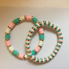 two bracelets that are sitting next to each other