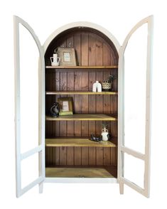 an open bookcase with shelves and vases on it