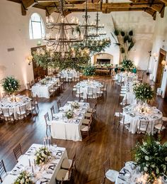 a large room with tables and chairs set up for a formal function in the center