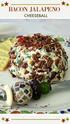 bacon jalapeno cheeseball on a plate with crackers