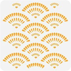 an orange and white wallpaper with many fan shaped designs on the back of it