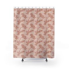 a shower curtain with an orange and pink flower pattern on the outside, in front of a white background