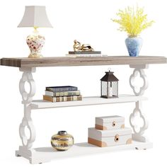 a white shelf with books and vases on it