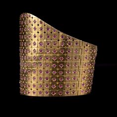 Mid-Century natural unheated Burmese ruby bangle bracelet in rose gold, 1950s/1960s. This jewel is designed with two hinged halves, creating a seamless fit. The front half, slightly larger, elegantly tapers down from the center, forming a sophisticated silhouette. Each cut-corner square plaque is intricately carved with an eight-ray star, each star centering around a vibrant round-shaped ruby. The meticulous craftsmanship and the brilliant sparkle of the rubies make this piece a true masterpiece Cabochon Bracelet, Ruby Bangles, Burmese Ruby, Bracelet Rose Gold, No Heat, Ruby Rose, Burmese, Cute Jewelry, Estate Jewelry