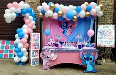 a pink and blue birthday party with balloons