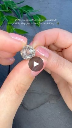 a person holding a diamond in their hand