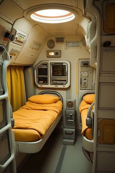 the inside of an airplane with two beds and bunks on each side, one is yellow