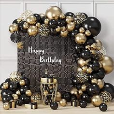 black and gold balloon arch with happy birthday message