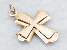 This beautifully crafted cross adds a classic touch to any look. Made with solid yellow 14-karat gold, this timeless piece features a stunning cross that adds a touch of faith and sophistication.This pendant does not come with the chain shown. Please feel free to contact us, we will help you find the perfect chain for your style and budget!Metal: 14K Yellow GoldMeasurements: 19 x 27 mm, with bail Polished 14k Gold Cross Jewelry, 14k Gold Cross Jewelry With Polished Finish, Polished Yellow Gold Cross Jewelry, Polished Cross Necklace For Formal Occasions, Yellow Gold Polished Cross Necklace Pendant, Formal Polished Cross Pendant Necklace, Formal Polished Cross Necklace, Classic 14k Gold Crucifix Jewelry And Charms, Yellow Gold Cross Pendant Stamped 14k