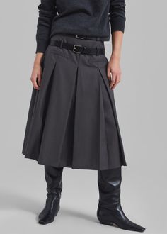 Color: Grey Lightweight woven fabric Relaxed fit Midi length Tennis pleats throughout Front illusion welt pockets Double belt loops Concealed side seam zip closure Partially lined 60% Polyester 25% Rayon 15% Wool Dry Clean By The Frankie Shop. Imported