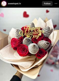 a bouquet of roses and chocolates with the words happy valentine's day written on it