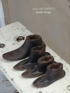 five old shoes are sitting on top of a white table in the process of being repaired