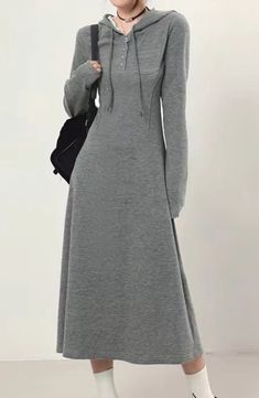 a woman wearing a grey dress and white socks Casual Gray Long Sleeve Dress, Casual Stretch Midi Dress For Winter, Casual Gray Long Sleeve Maxi Dress, Casual Solid Midi Dress For Winter, Long Cotton Winter Dress, Casual Cotton Winter Dress, Winter Long Sleeve Maxi Dress With Buttons, Long Cotton Dress For Winter, Casual Winter Cotton Dress