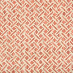 an orange and white pattern on fabric