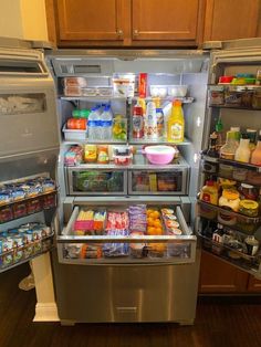 an open refrigerator filled with lots of food