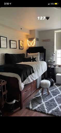 a bed room with a neatly made bed and pictures on the wall