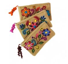 two small bags with embroidered flowers on them