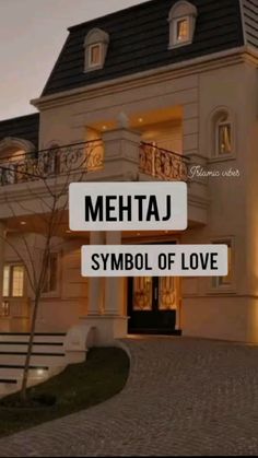 a large house with the words mettaj symbol of love in front of it