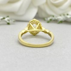 This beautiful ring is made from genuine 925 sterling silver with yellow gold plating. Engagement Ring details- -The Main stone is an oval cut 8mm by 6mm Simulated Diamond -Side stones are Round 1.3mm and 1mm simulated diamonds -Ring is casted in solid 925 sterling silver with yellow gold plating ( Rose gold and rhodium plated also available, please check the drop down menu for more options) -The Total face height of the ring measures 10mms and the band width measures 2mms -Each ring is handmade Gold Oval Cabochon Diamond Ring, Gold Marquise Gemstone Wedding Jewelry, Gold Oval Opal Ring Fine Jewelry, Gold Diamond Ring With Oval Cabochon Gemstone, Gold Oval Cabochon Diamond Ring With Gemstone, Gold Marquise Cut Jewelry With Halo Setting, Elegant Gold Oval Opal Ring, Gold Diamond Ring With Oval Cabochon Center Stone, Oval Cluster Ring With Halo Design For Promise