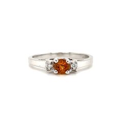 Round Citrine Ring with Side Diamonds in 14K White Gold Front View Alternative Classic Orange Topaz Ring With Prong Setting, Classic Round Cut Topaz Birthstone Ring, Orange Diamond Topaz Ring With Center Stone, Orange Diamond Ring With Prong Setting, Orange Topaz Ring With Diamond Center Stone, Orange Diamond Rings With Prong Setting, Classic Orange Topaz Ring For Anniversary, Classic Orange Topaz Round Ring, Classic Orange Diamond Ring