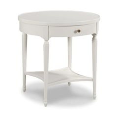 a small white table with one drawer on the top and two drawers on the bottom