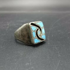 "VINTAGE HOPI HUMMINGBIRD DESIGN TURQUOISE INLAY SIGNET RING DESCRIPTION: This powerful ring will be a treasured addition to your collection of fine vintage Native American jewelry. MEASUREMENTS: Ring face measures 11/16\" x 7/16\" RING SIZE: 9 WEIGHT: 12.9 grams SIGNED: HN, for Stephen Hyson Naseyoma (Hopi) STERLING: unmarked, verified sterling silver" Vintage Adjustable Rectangular Ring, Vintage Sterling Silver Rings With Inlay, Vintage Inlay Rings For Anniversary, Vintage Rectangular Rings For Collectors, Vintage Silver Ring With Patina, Vintage Turquoise Inlay Ring For Gift, Vintage Turquoise Ring With Inlay For Anniversary, Vintage Silver Rectangular Ring, Vintage Blue Rings With Inlay