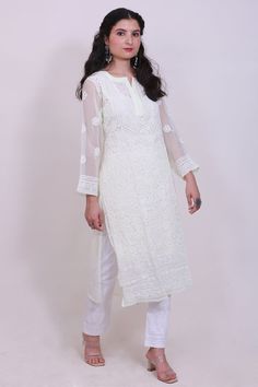 This hand embroidered Leher Georgette Kurti is a beautiful piece to wear at brunch, casual outings and other special occasions.It can be teamed up with hand emboidered chiaknakri pant, sandals and matching earrings to make your getup complete.The color combination with white embroidery is perfect to fit any occasion and comes with matching inner to make you look glamorous. Small Patterns, Earrings To Make, Lemon Top, Embroidered Kurti, Heavy Embroidery, Pakistani Outfits, White Embroidery, Top Fabric, Embroidery Pattern