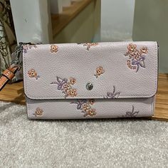 New Authentic Coach Pebbled Leather Triple Wristlet With Removable Strap. Ligh Lavender-Pink With Contrasting Flax And Coral Zipper Pockets. Inside Flap Of Snap Pocket Is Lin D In Coral Leather. Hang Tag Has Tiny Spot See Pic. 7 Across X 4 High. Thanks For Shopping With Me. Pink Pouch Wristlet For Spring, Spring Pink Pouch Wristlet, Coach Spring Pouch Wallet, Coach Pouch Wallet For Spring, Elegant Pink Wristlet For Spring, Spring Clutch Wallet With Removable Pouch, Coach Keychain, Lavender Pink, Wristlet Clutch