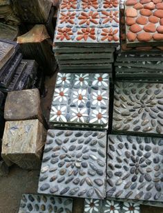 several different types of tiles stacked on top of each other