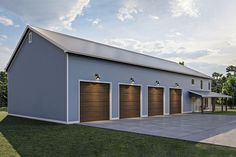 a two story garage with three doors on each side